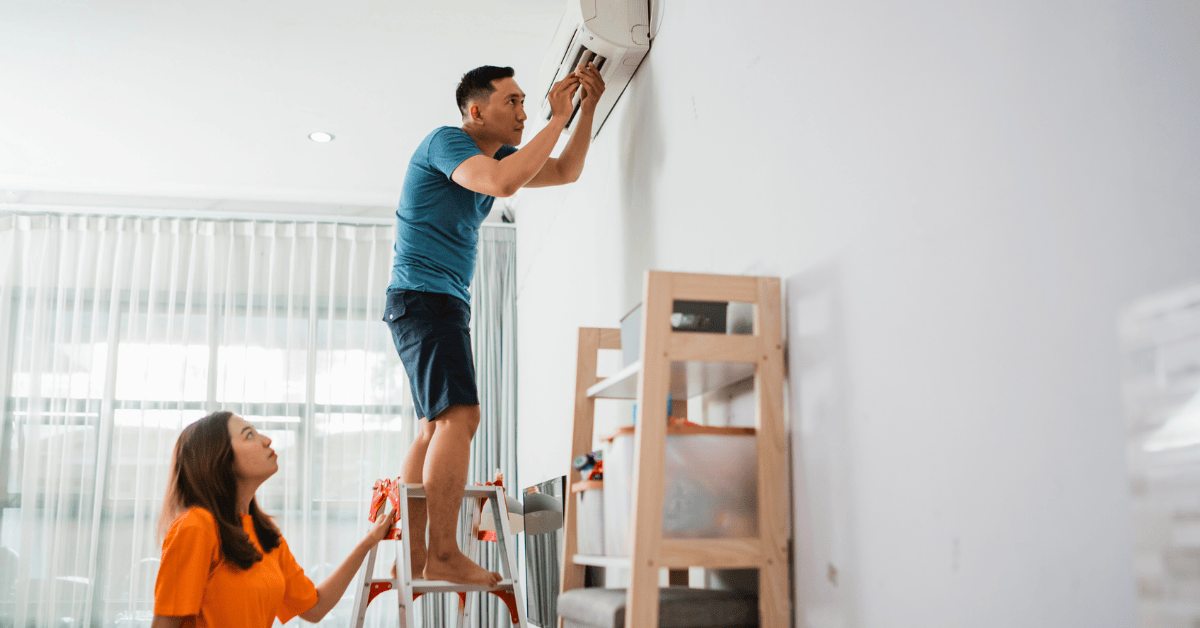 couple trying to repair ductless mini split