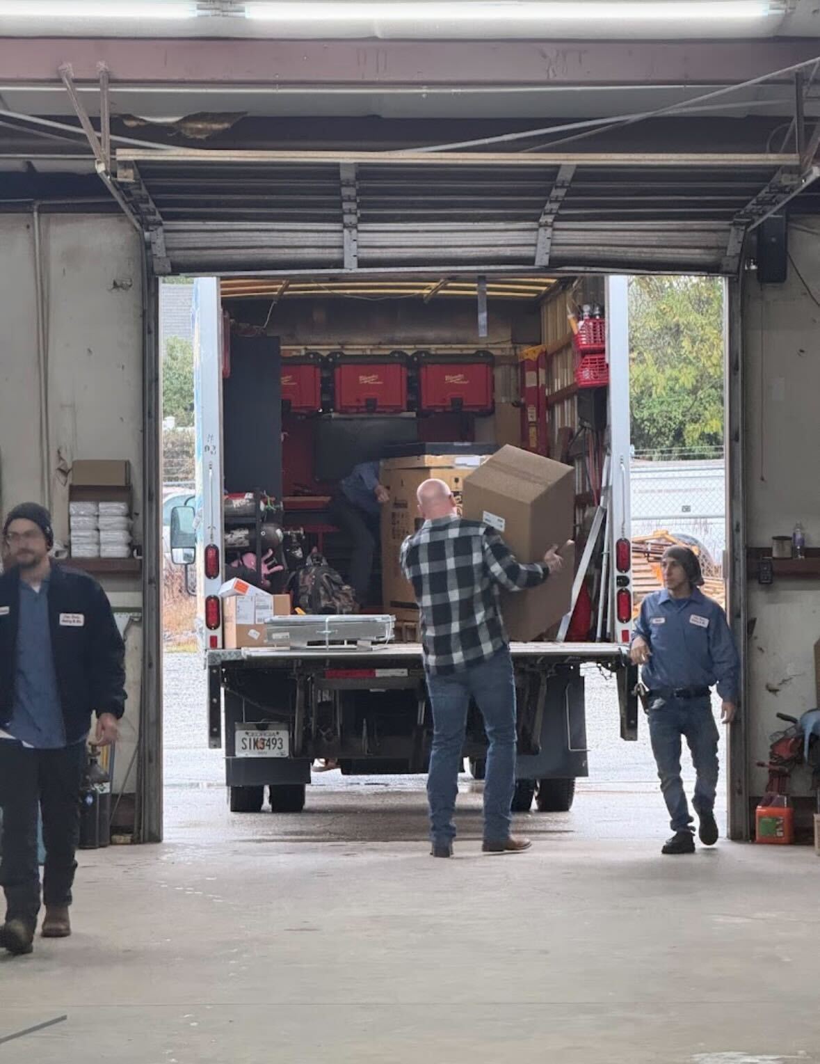 John Davis Heating and Air team performing HVAC installation