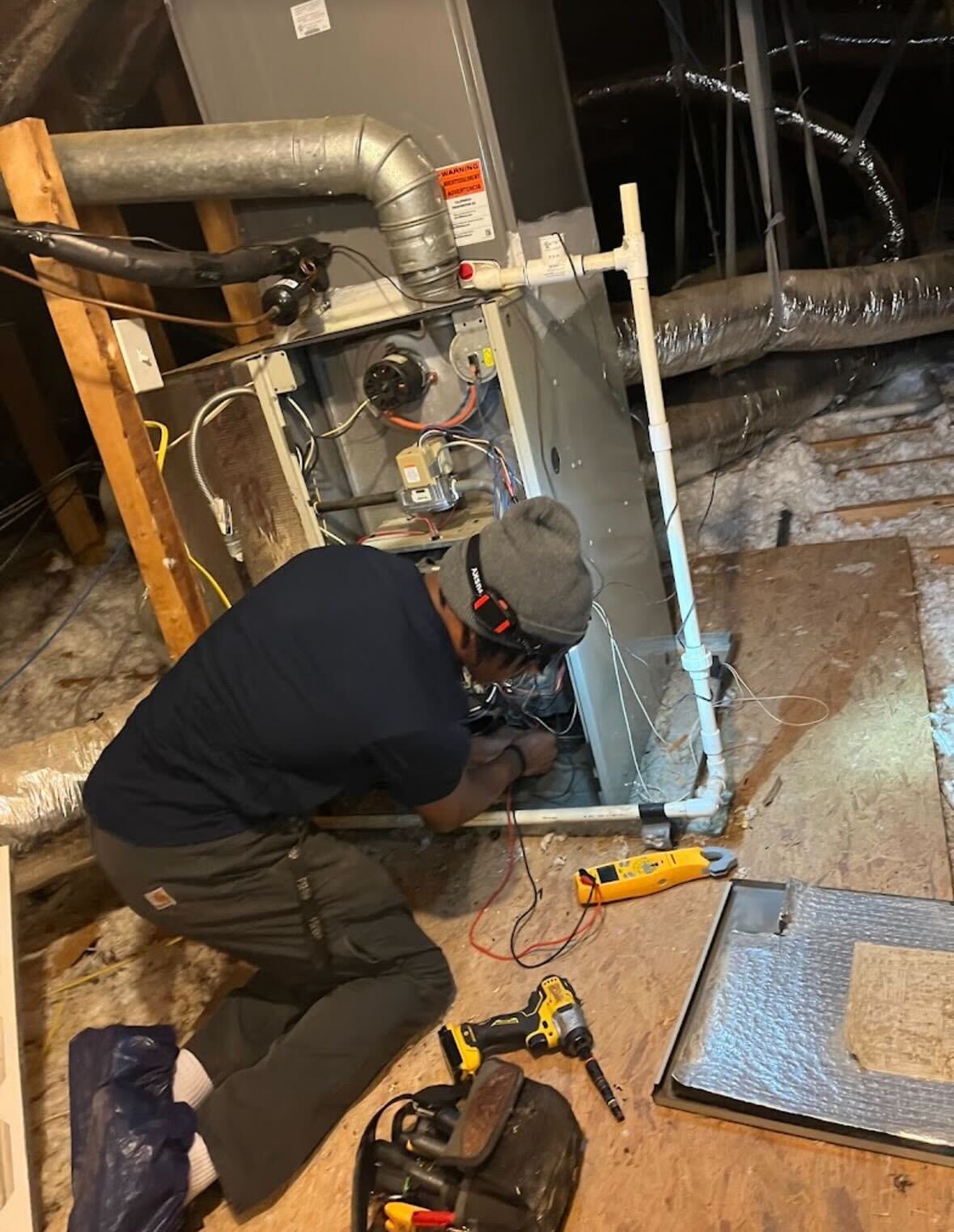 HVAC technician servicing electric furnace in Peachtree City GA